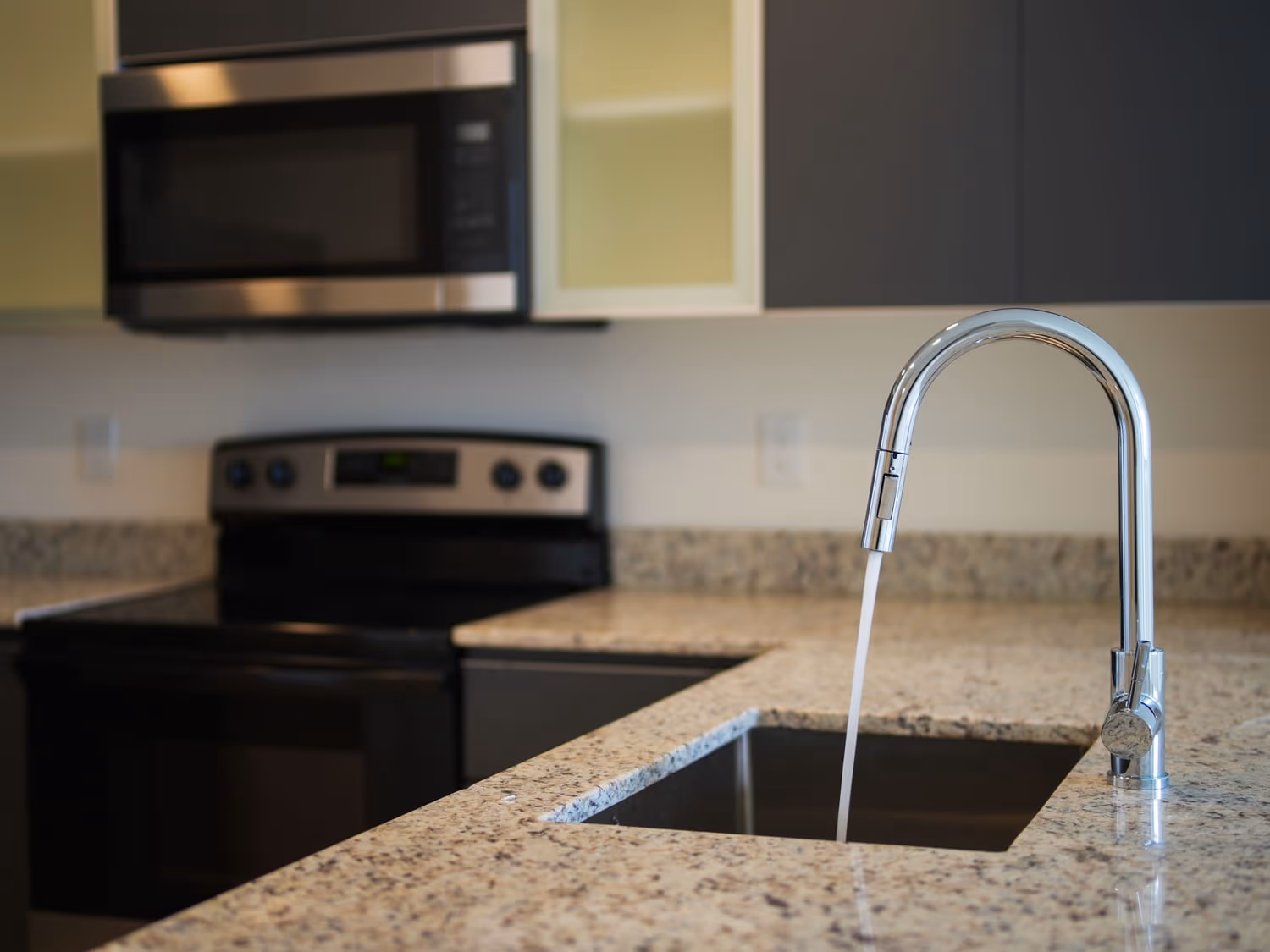 Granite kitchen countertop with a modern faucet
