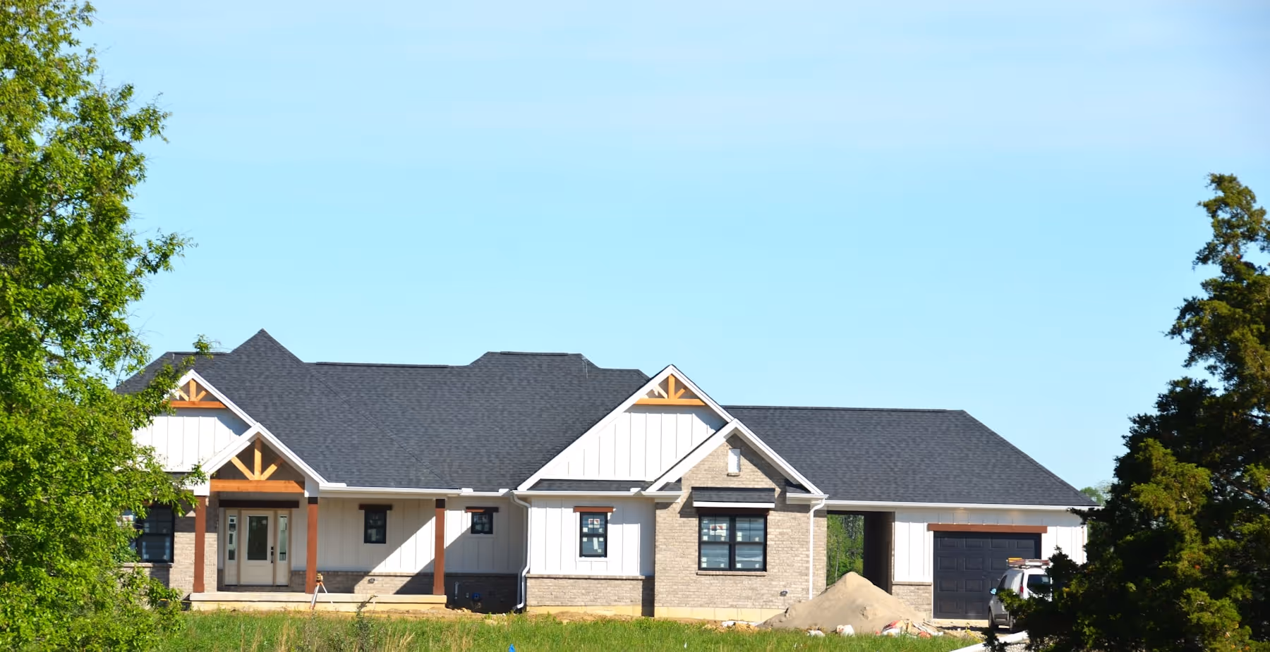 Residential house under construction with the exterior shell and roof in place