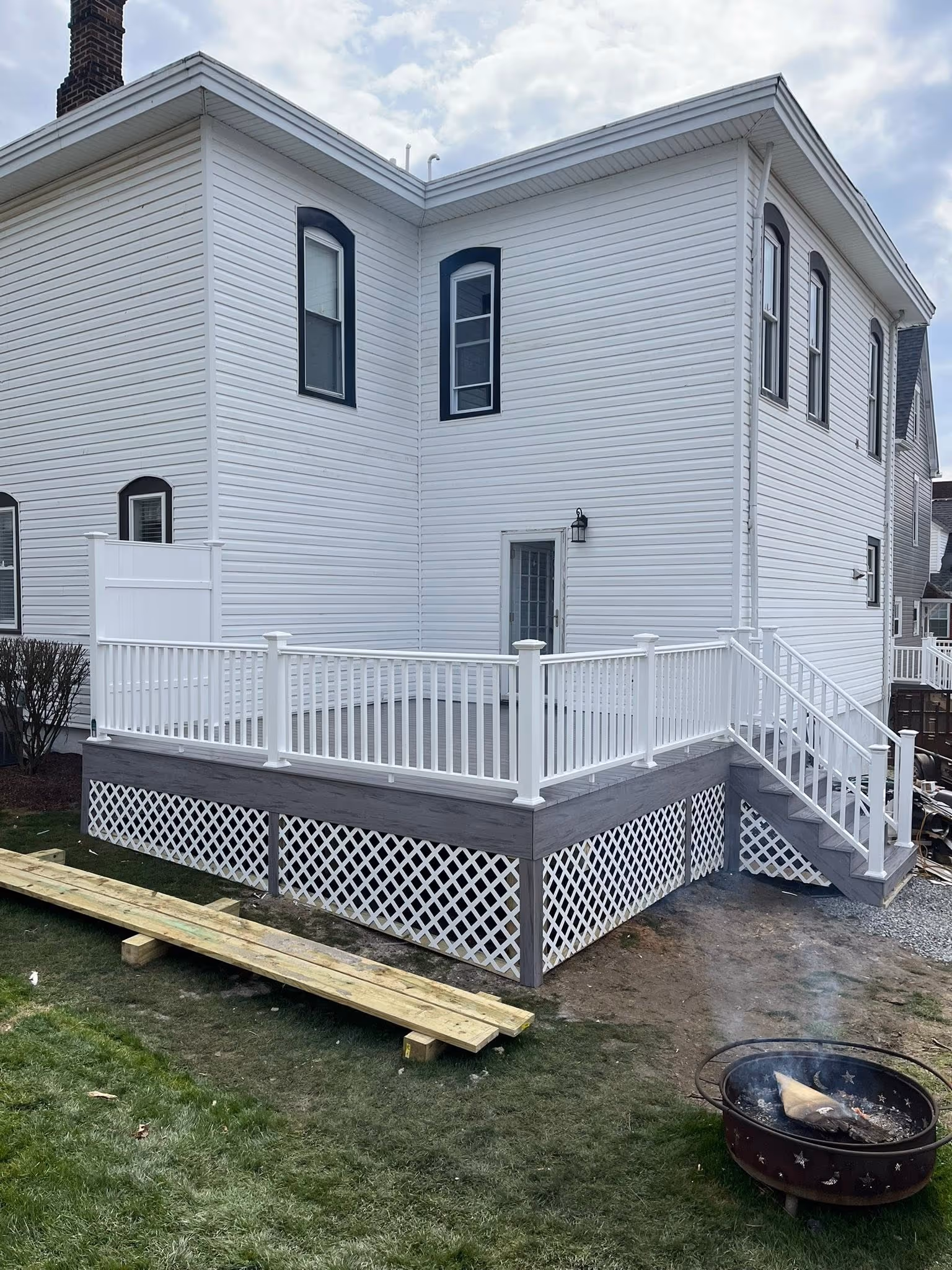 Exterior stairs and white railing on a Pittsburgh-area home